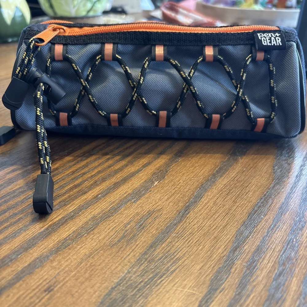 The Pen + Gear Athletic Bungee Polyester Pencil Pouch in black and orange